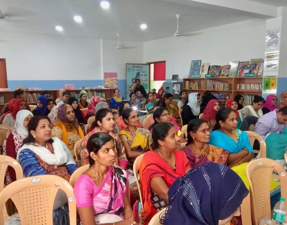 Workshop participants seated and listening